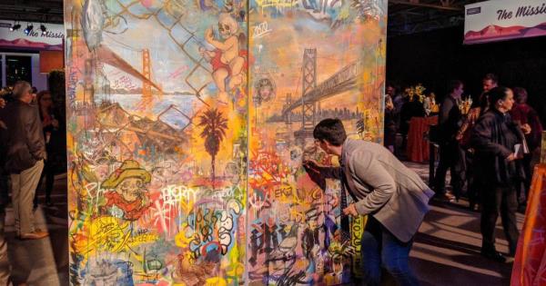 attendee interacting with mural wall at strategic event